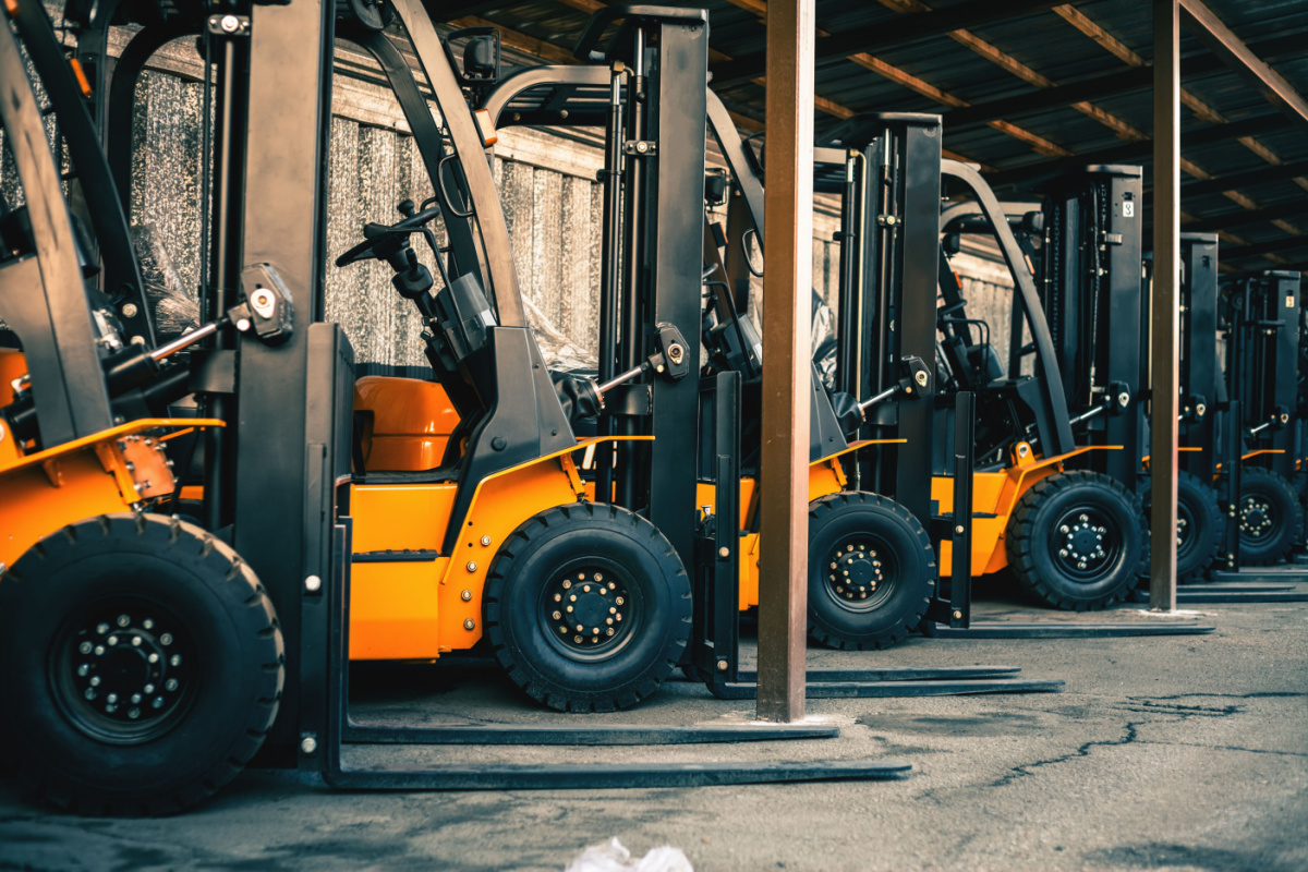 Lined up forklifts in warehouse