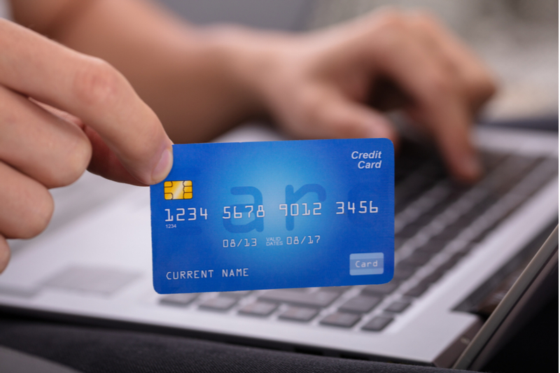 Man holding a small business credit card.