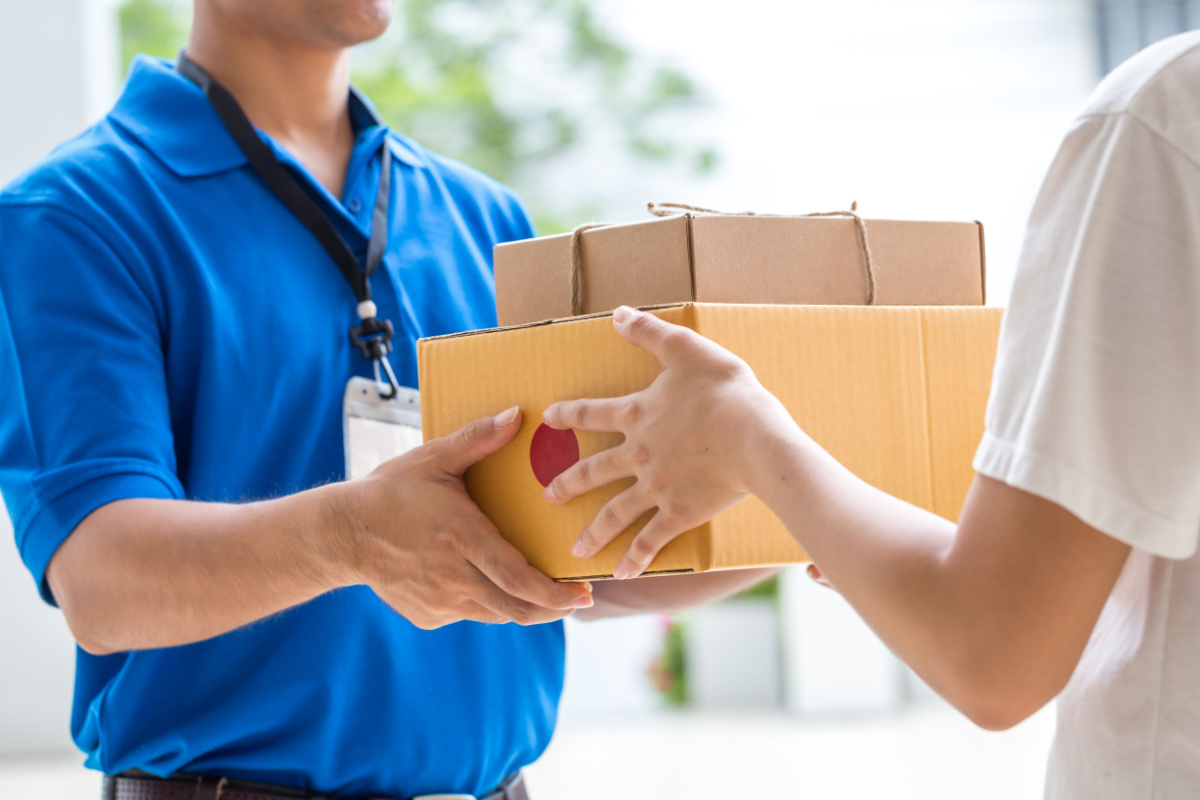 Courier delivering packages to indivdiual