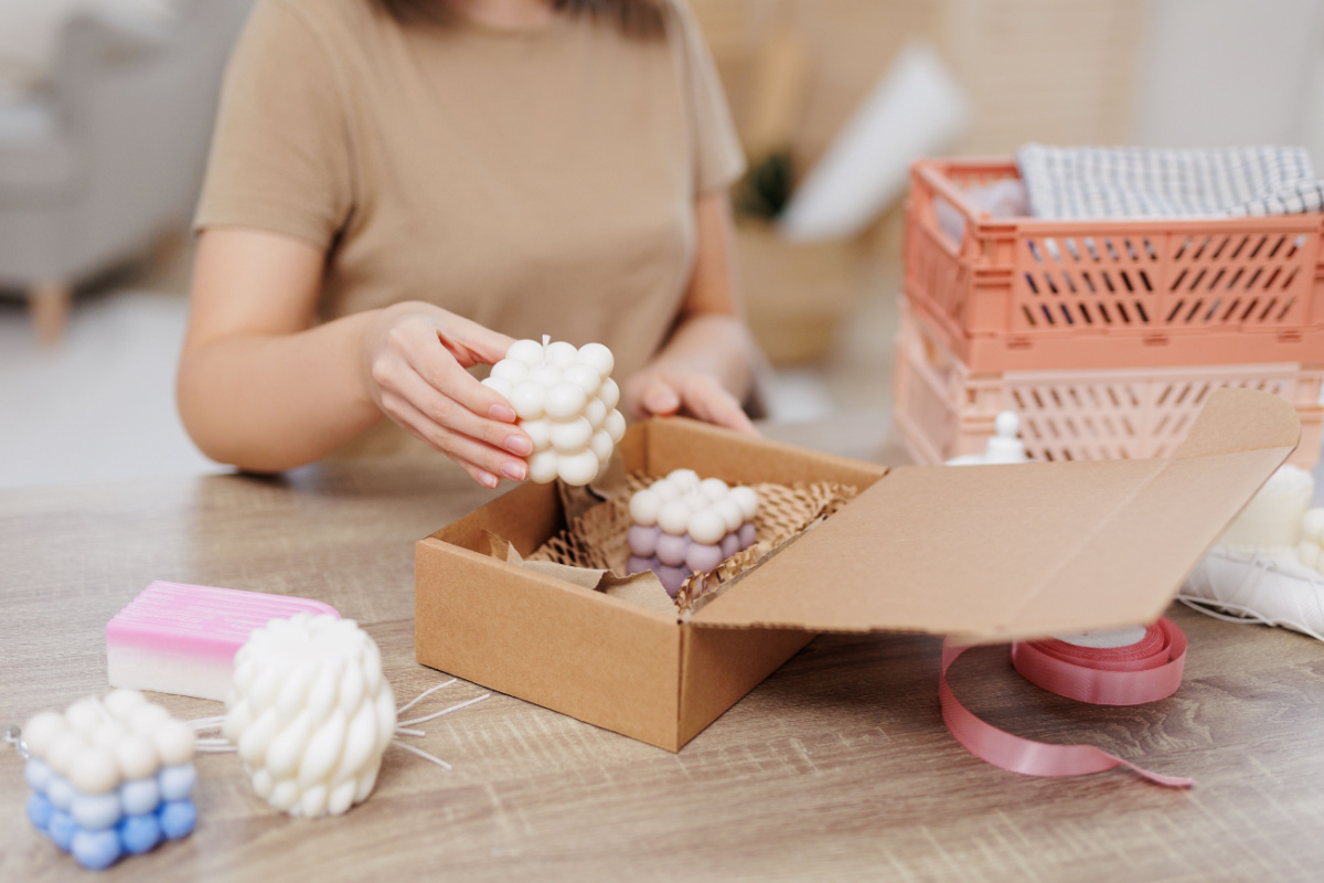 Business owner packaging candles