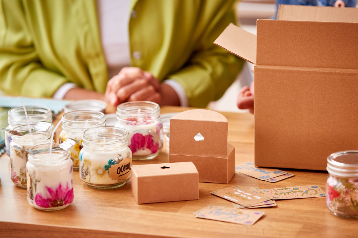 Business owner packaging candles