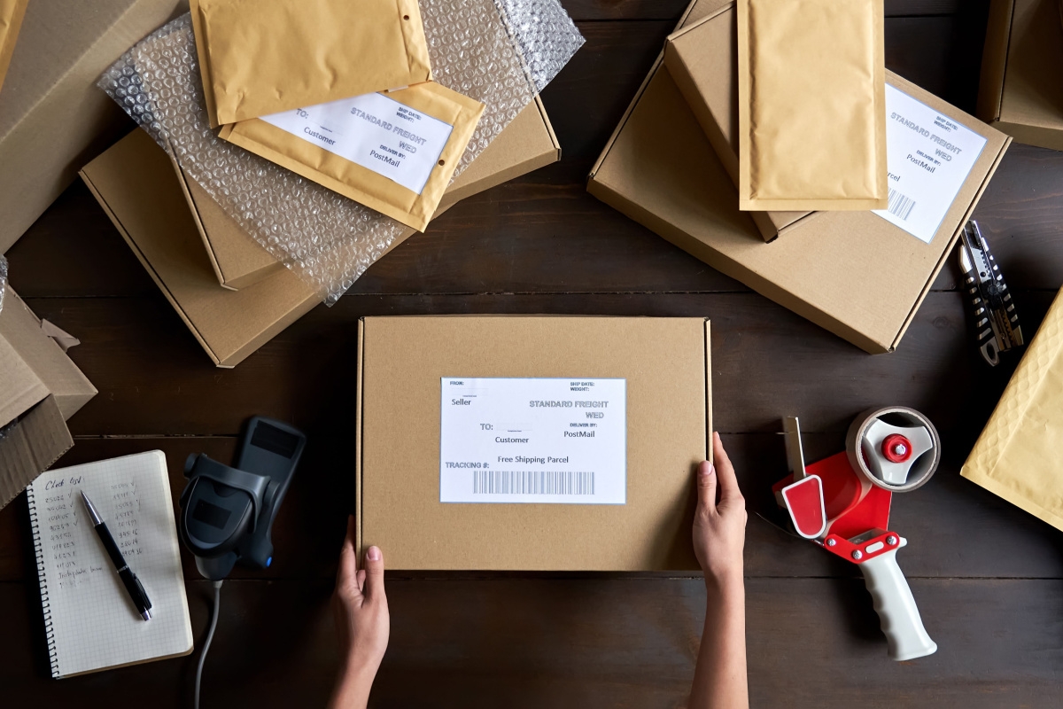 E-commerce business owner packaging orders