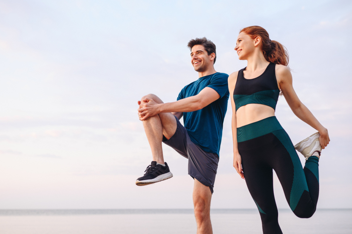 Young adults stretching before workout