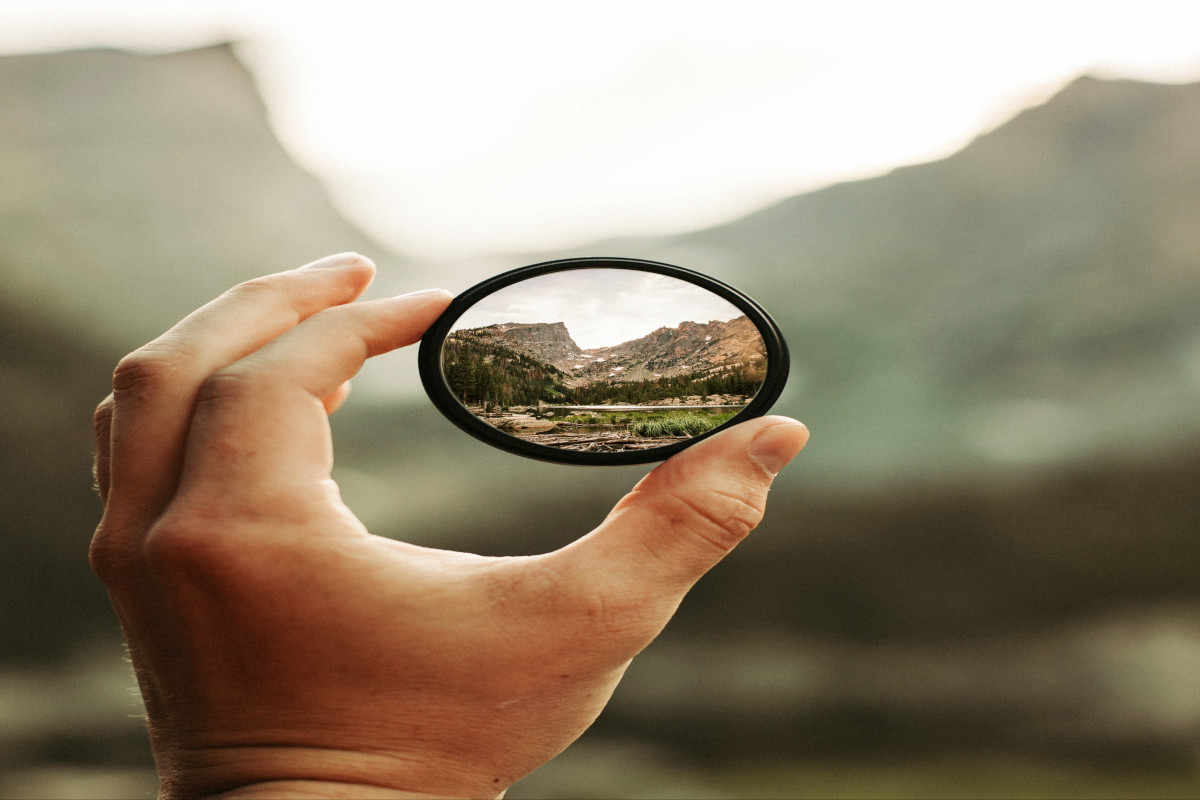 Someone focusing through a lens. 