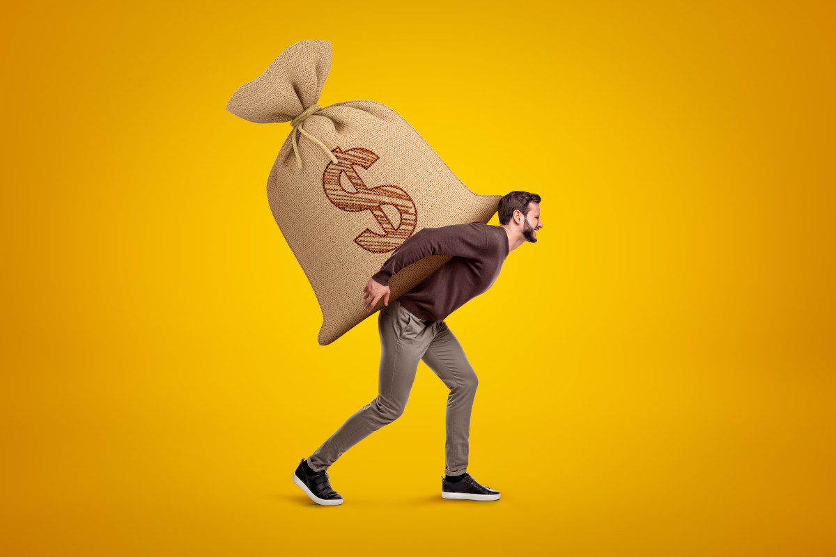 One person carrying a bag of money. 