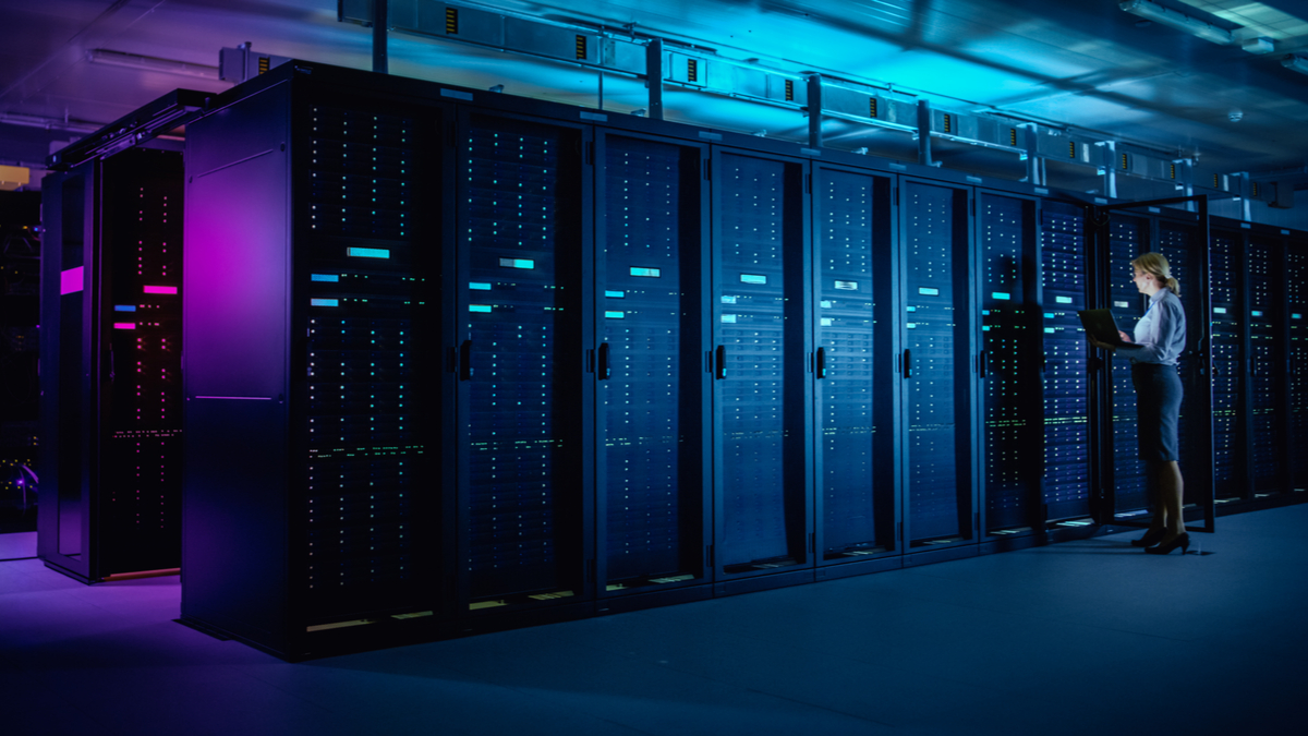 Woman checking on servers.