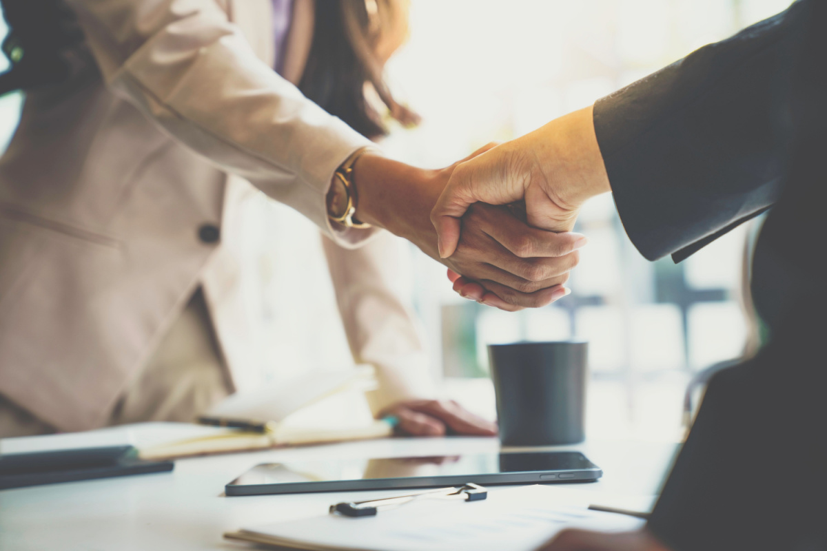 Close up on partners shaking hands