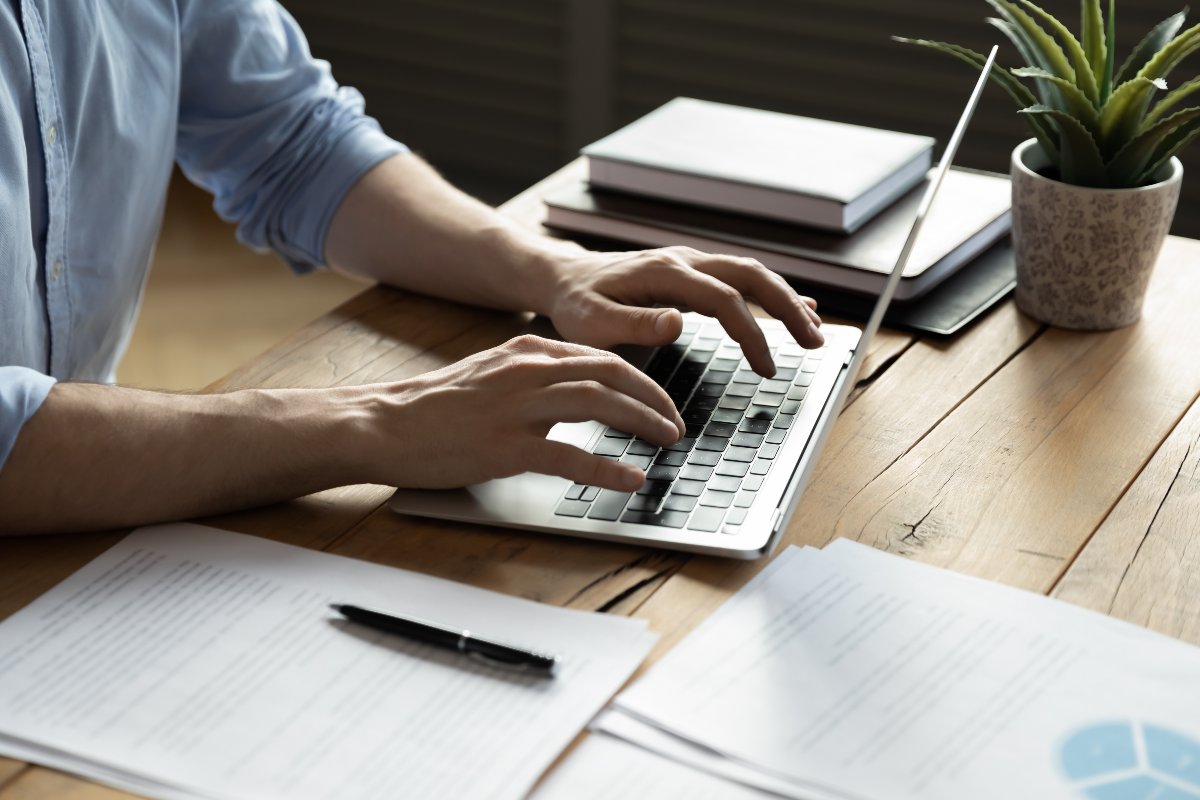 Entrepreneur conducting research on laptop