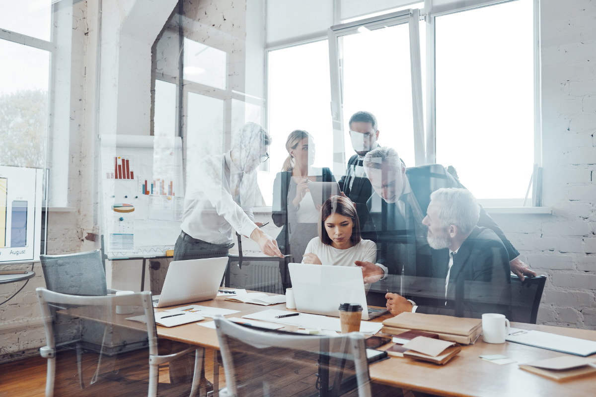 Woman sitting at desk working on project.