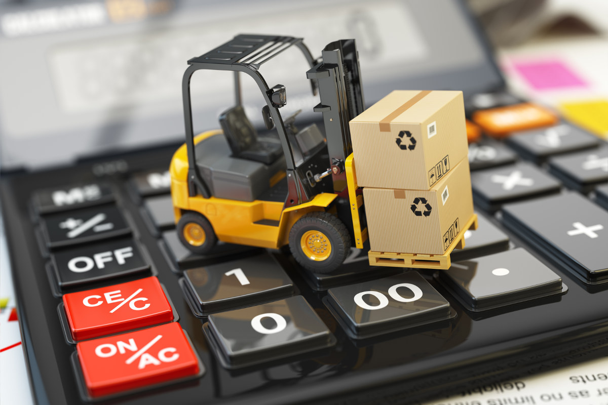 Tiny forklift with boxes on top of a calculator.