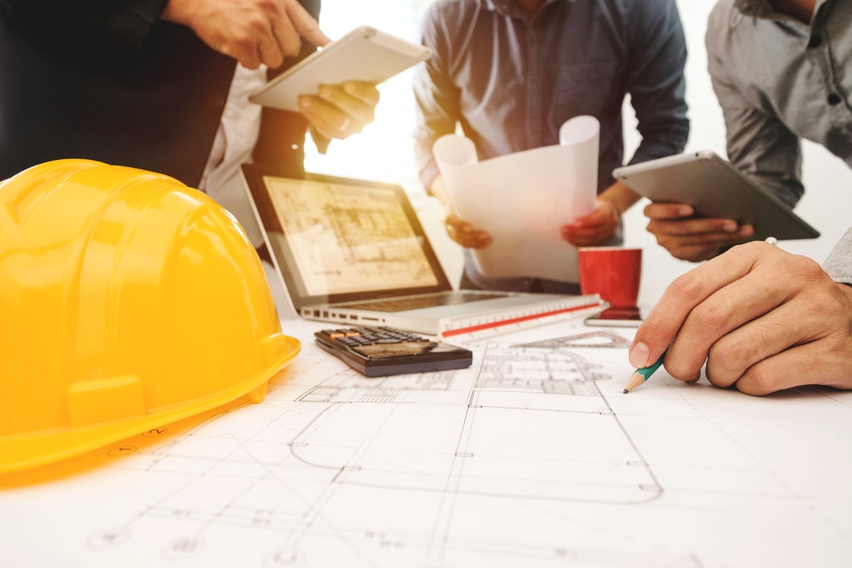 Group of construction workers planning a project.