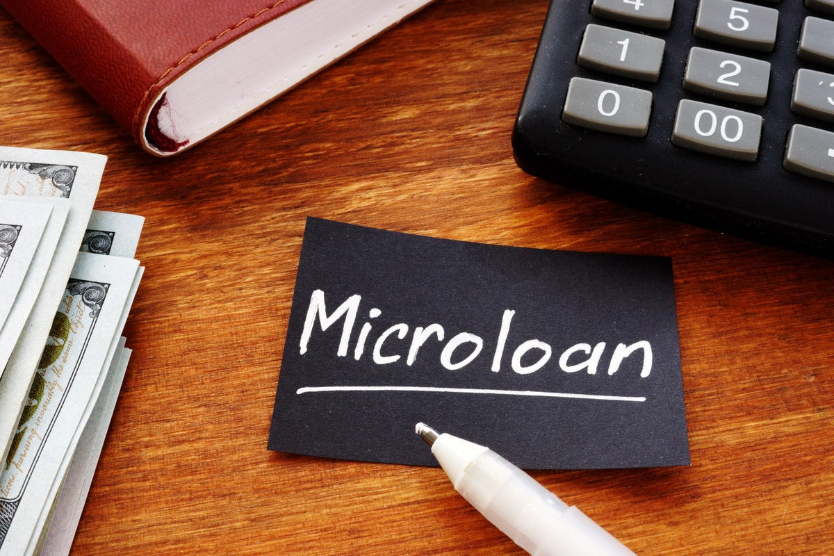 Piece of paper with the word Microloan on it.