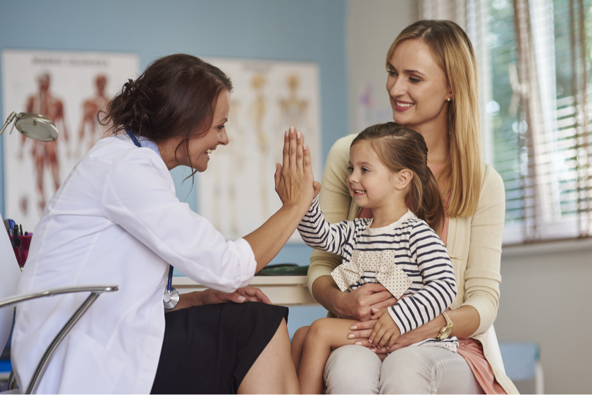 Pediatrician helps kid at a medical practice